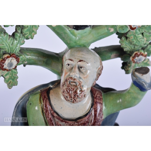 447 - A LARGE EARLY 19TH CENTURY STAFFORDSHIRE PEARLWARE FIGURE OF ELIJAH. 27 cm x 12 cm.