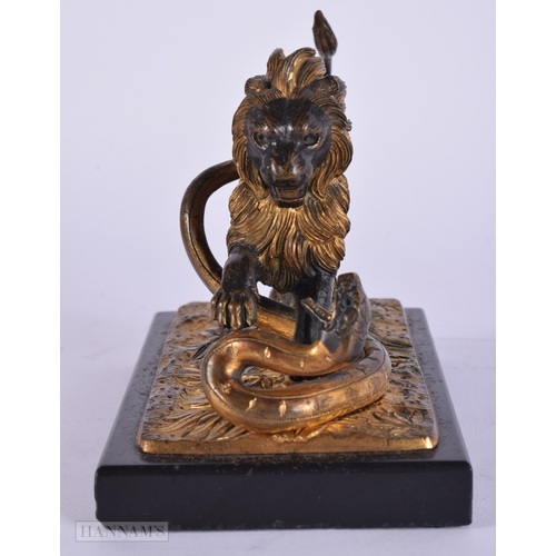 471 - A FINE EARLY 19TH CENTURY FRENCH BRONZE AND PARTIAL GILT BRONZE LION modelled attacking a snake upon... 
