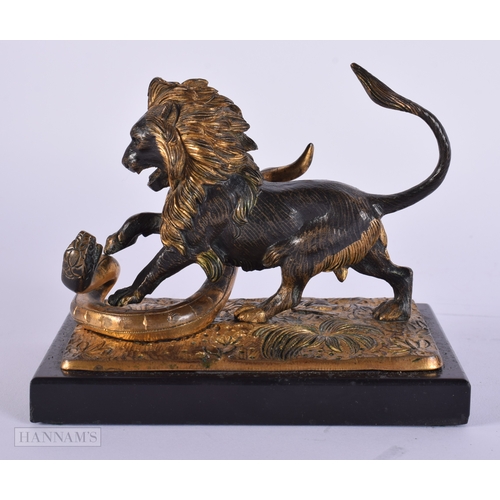 471 - A FINE EARLY 19TH CENTURY FRENCH BRONZE AND PARTIAL GILT BRONZE LION modelled attacking a snake upon... 