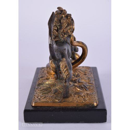 471 - A FINE EARLY 19TH CENTURY FRENCH BRONZE AND PARTIAL GILT BRONZE LION modelled attacking a snake upon... 
