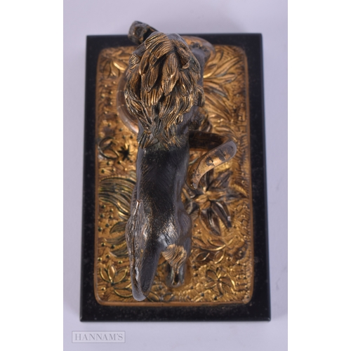 471 - A FINE EARLY 19TH CENTURY FRENCH BRONZE AND PARTIAL GILT BRONZE LION modelled attacking a snake upon... 