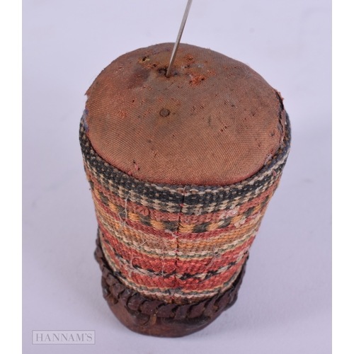 472 - AN ANTIQUE CONTINENTAL LEATHER EMBROIDERED PIN CUSHION. 9 cm x 5.5 cm.
