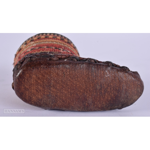 472 - AN ANTIQUE CONTINENTAL LEATHER EMBROIDERED PIN CUSHION. 9 cm x 5.5 cm.