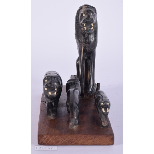 474 - A 19TH CENTURY MIDDLE EASTERN CARVED RHINOCEROS HORN FIGURAL GROUP. 287 grams overall. 14 cm x 14 cm... 