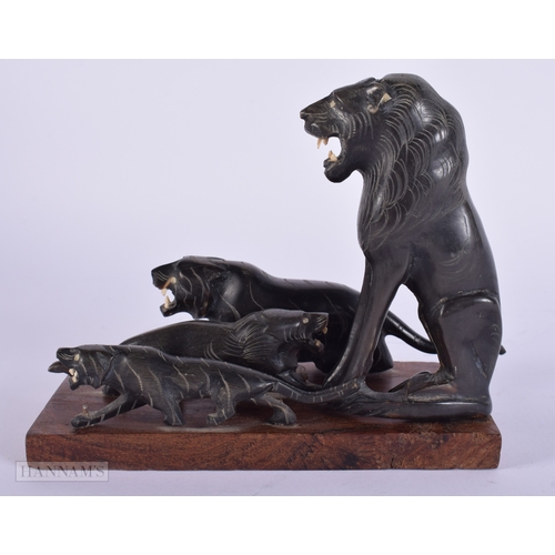 474 - A 19TH CENTURY MIDDLE EASTERN CARVED RHINOCEROS HORN FIGURAL GROUP. 287 grams overall. 14 cm x 14 cm... 