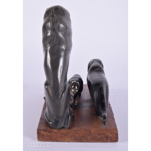 474 - A 19TH CENTURY MIDDLE EASTERN CARVED RHINOCEROS HORN FIGURAL GROUP. 287 grams overall. 14 cm x 14 cm... 