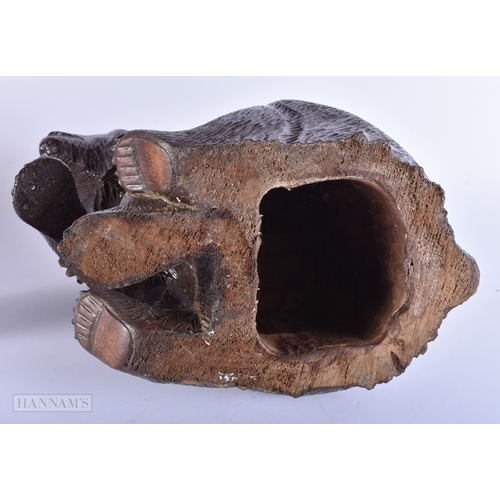 58 - A LARGE EARLY 20TH CENTURY BAVARIAN BLACK FOREST CARVED WOOD BEAR modelled with one arm raised. 32 c... 