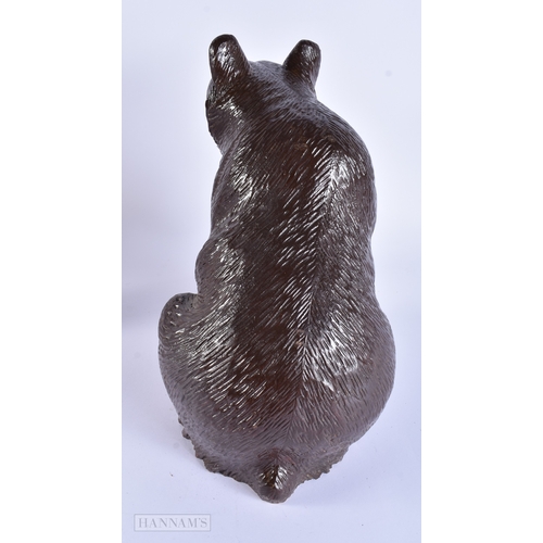 58 - A LARGE EARLY 20TH CENTURY BAVARIAN BLACK FOREST CARVED WOOD BEAR modelled with one arm raised. 32 c... 