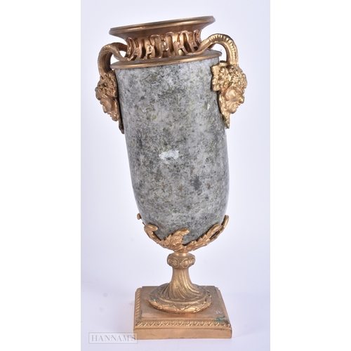 7 - A 19TH CENTURY FRENCH GILT BRONZE AND MARBLE URN decorated with mask heads. 24.5 cm high.