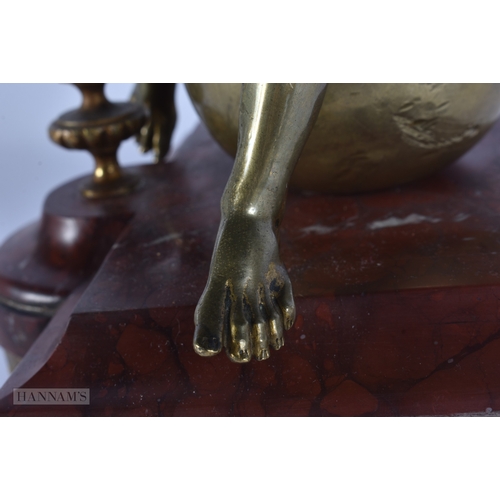 101 - A FINE EARLY 19TH CENTURY EUROPEAN GRAND TOUR GILT BRONZE FIGURE OF KRONOS modelled upon a red marbl... 