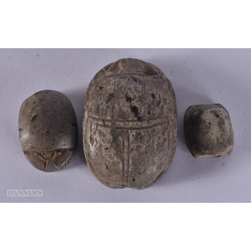 105 - TWO ANTIQUE EGYPTIAN CARVED STONE SCARAB BEETLES together with another similar item. Largest 3.25 cm... 