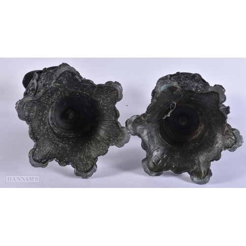 11 - A PAIR OF VICTORIAN CAST METAL CANDLESTICK HOLDERS together with a plated tankard. Largest 38 cm hig... 