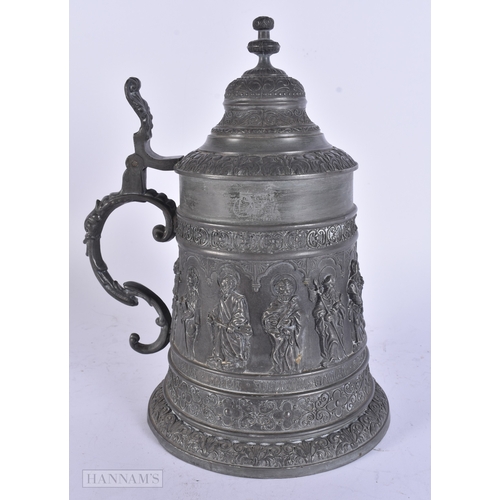 11 - A PAIR OF VICTORIAN CAST METAL CANDLESTICK HOLDERS together with a plated tankard. Largest 38 cm hig... 
