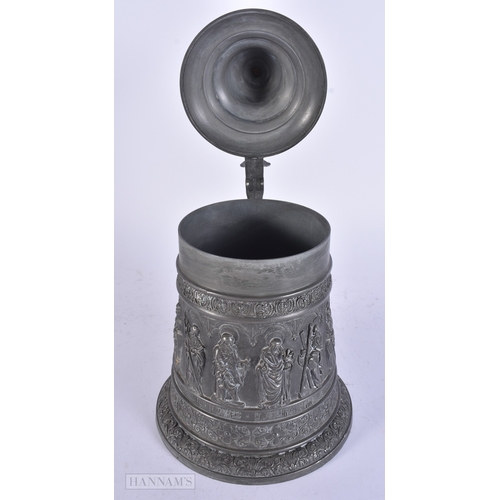 11 - A PAIR OF VICTORIAN CAST METAL CANDLESTICK HOLDERS together with a plated tankard. Largest 38 cm hig... 
