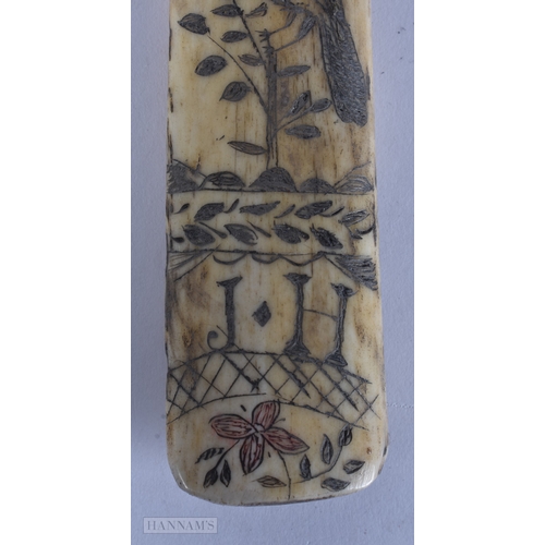 117 - A MID 19TH CENTURY SAILOR ENGRAVED SCRIMSHAW LAST engraved with birds, urns and flowers. 19cm long.