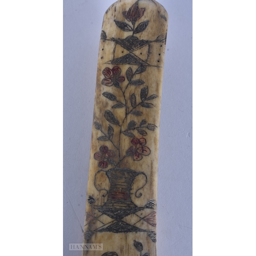 117 - A MID 19TH CENTURY SAILOR ENGRAVED SCRIMSHAW LAST engraved with birds, urns and flowers. 19cm long.
