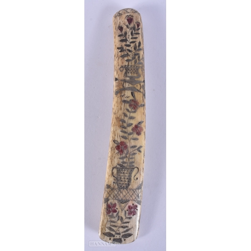 117 - A MID 19TH CENTURY SAILOR ENGRAVED SCRIMSHAW LAST engraved with birds, urns and flowers. 19cm long.
