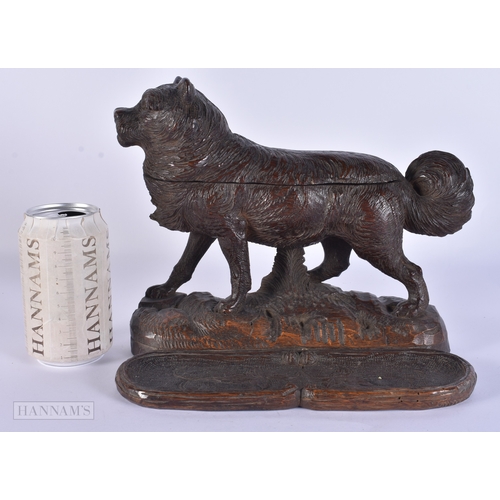 118 - A RARE AND LARGE 19TH CENTURY BAVARIAN BLACK FOREST CARVED WOOD INKWELL formed as a roaming dog, the... 