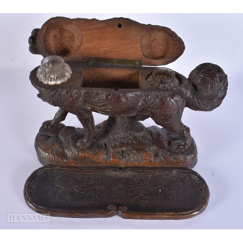 118 - A RARE AND LARGE 19TH CENTURY BAVARIAN BLACK FOREST CARVED WOOD INKWELL formed as a roaming dog, the... 