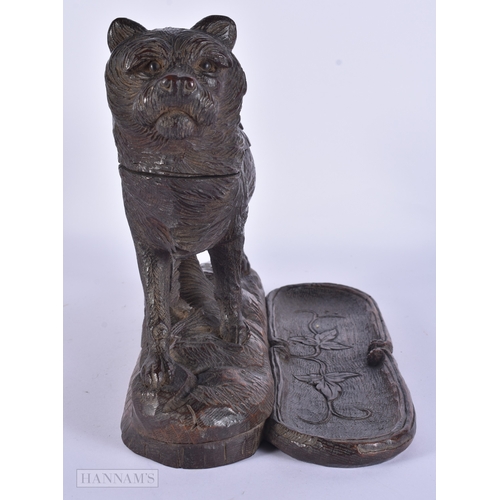 118 - A RARE AND LARGE 19TH CENTURY BAVARIAN BLACK FOREST CARVED WOOD INKWELL formed as a roaming dog, the... 