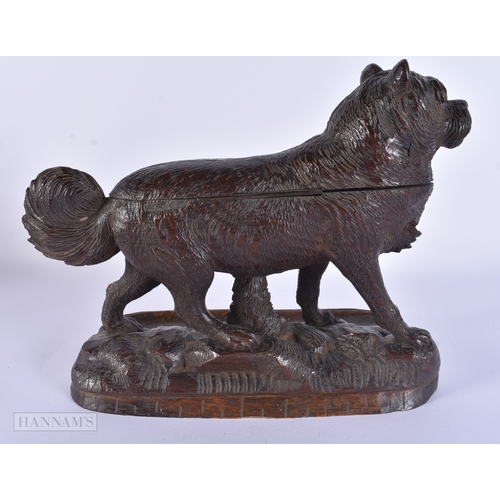 118 - A RARE AND LARGE 19TH CENTURY BAVARIAN BLACK FOREST CARVED WOOD INKWELL formed as a roaming dog, the... 
