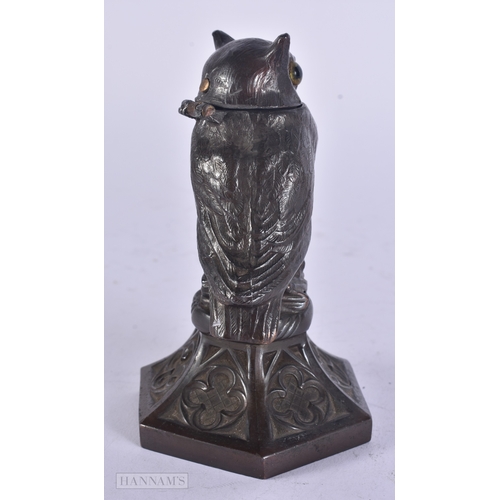 13 - A RARE ANTIQUE NOVELTY SPELTER OWL LIGHTER with glass eyes. 13.5 cm high.