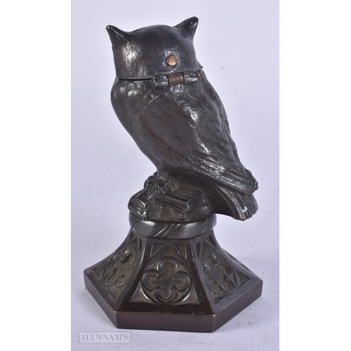 13 - A RARE ANTIQUE NOVELTY SPELTER OWL LIGHTER with glass eyes. 13.5 cm high.