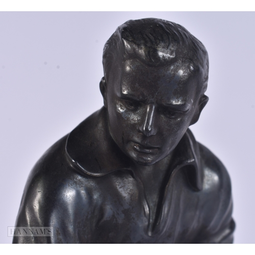 17 - AN UNUSUAL ART DECO SPELTER HOCKEY PLAYER modelled upon a marble base. 24.5 cm high.