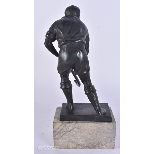17 - AN UNUSUAL ART DECO SPELTER HOCKEY PLAYER modelled upon a marble base. 24.5 cm high.