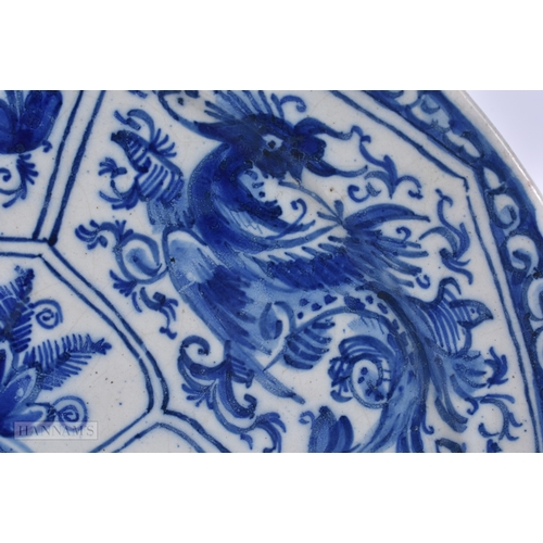 35 - A RARE 18TH CENTURY DELFT BLUE AND WHITE POTTERY PLATE modelled in the Chinese Ming style. 25 cm dia... 
