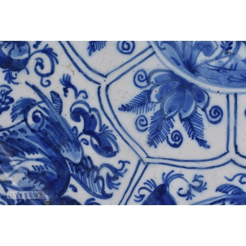 35 - A RARE 18TH CENTURY DELFT BLUE AND WHITE POTTERY PLATE modelled in the Chinese Ming style. 25 cm dia... 
