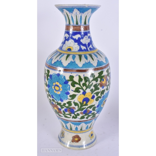 48 - A LARGE MIDDLE EASTERN IZNIK PERSIAN ISLAMIC FAIENCE VASE. 29 cm high.