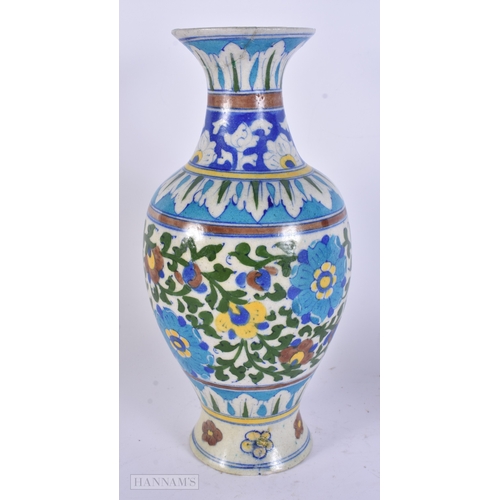 48 - A LARGE MIDDLE EASTERN IZNIK PERSIAN ISLAMIC FAIENCE VASE. 29 cm high.