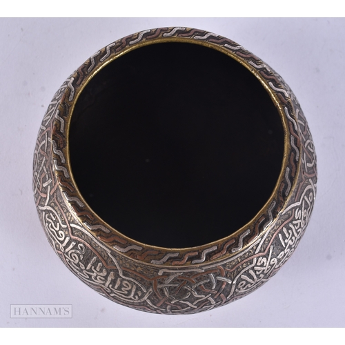 49 - A 19TH CENTURY ISLAMIC MIDDLE EASTERN SILVER INLAID CENSER decorated with scripture. 12 cm wide.