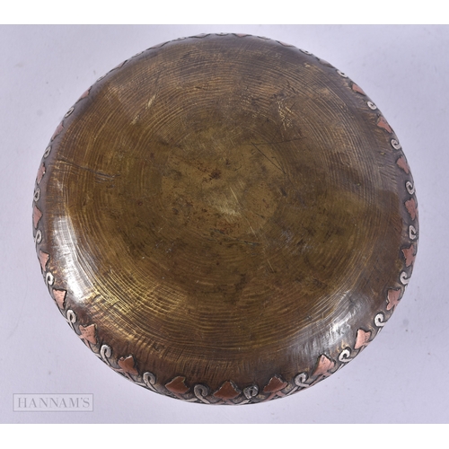 49 - A 19TH CENTURY ISLAMIC MIDDLE EASTERN SILVER INLAID CENSER decorated with scripture. 12 cm wide.