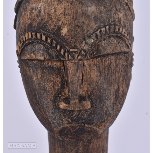 54 - TWO AFRICAN TRIBAL CARVED WOOD FIGURES. Largest 59 cm long inc material. (2)