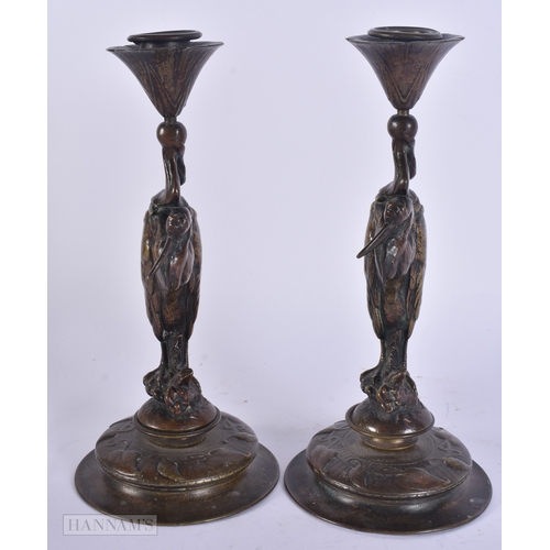57 - Auguste Nicolas Cain (19th Century) Pair, Bronze bird candlesticks. 25 cm high.