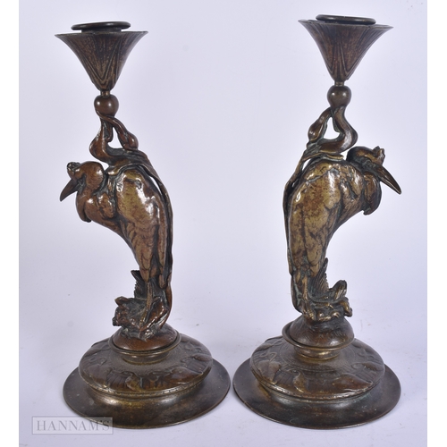 57 - Auguste Nicolas Cain (19th Century) Pair, Bronze bird candlesticks. 25 cm high.