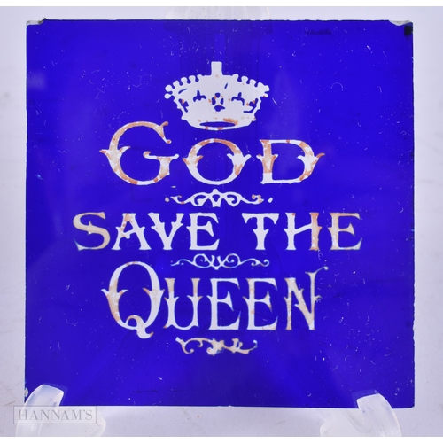 68 - A VICTORIAN/EDWARDIAN BRISTOL BLUE GLASS GOD SAVE THE QUEEN PLAQUE. 8.25 cm square.
