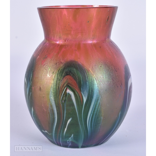 81 - AN IRIDESCENT GLASS PEACOCK FEATHER SWIRL VASE. 10.5 cm x 8.5 cm.