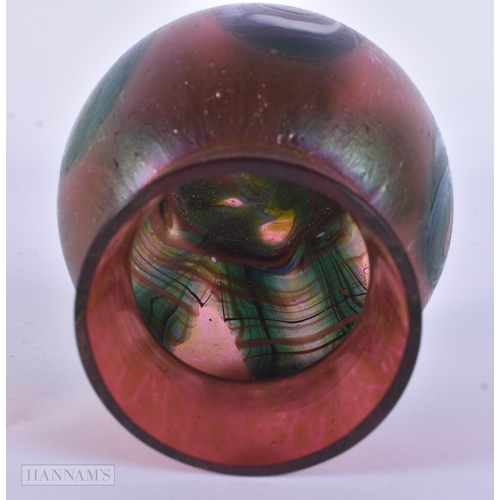 81 - AN IRIDESCENT GLASS PEACOCK FEATHER SWIRL VASE. 10.5 cm x 8.5 cm.