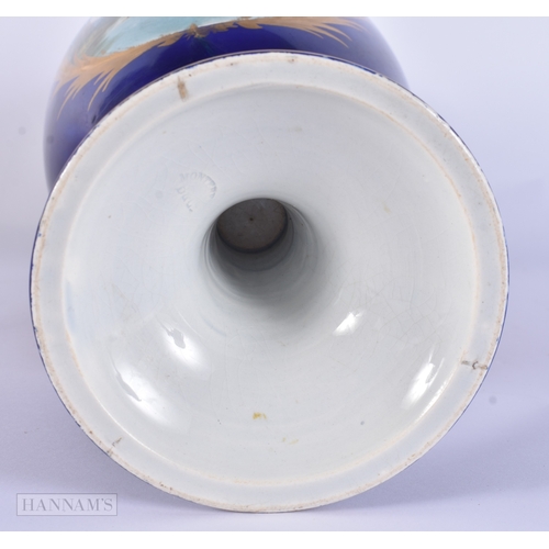 84 - A LARGE 19TH CENTURY FRENCH SEVRES STYLE PORCELAIN VASE painted with figures in an interior. 39 cm h... 