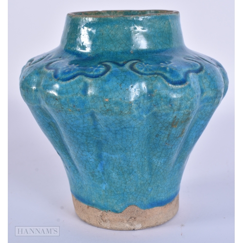 98 - AN EARLY ISLAMIC PERSIAN MIDDLE EASTERN TURQUOISE GLAZED JAR. 12.5 cm x 12 cm.