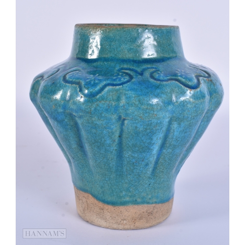 98 - AN EARLY ISLAMIC PERSIAN MIDDLE EASTERN TURQUOISE GLAZED JAR. 12.5 cm x 12 cm.
