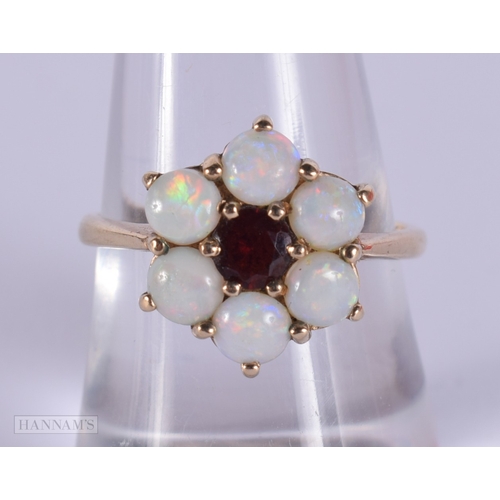 1127 - 9ct gold opal and garnet cluster ring.  Size P (3.5g)