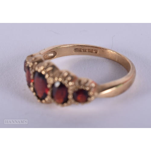 1134 - 9ct gold vintage garnet set five stone ring.  Size N (2.4g)