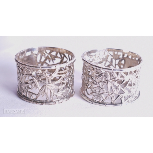 1165 - Pair of .900 Silver Wang Hing Chinese Export Napkin Rings 52g. 4.25 cm wide.