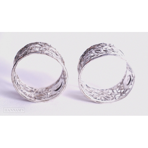 1165 - Pair of .900 Silver Wang Hing Chinese Export Napkin Rings 52g. 4.25 cm wide.