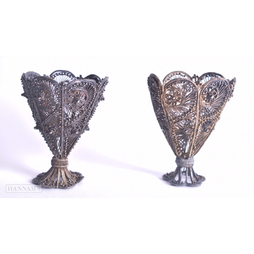 1166 - .950 silver filigree egg cups 69g. 5.75 cm x 4.75 cm.