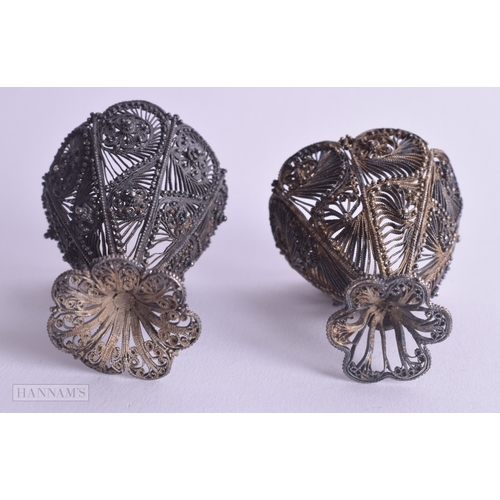 1166 - .950 silver filigree egg cups 69g. 5.75 cm x 4.75 cm.